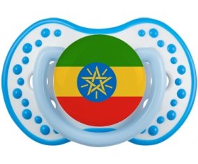 Drapeau Ethiopie Sucette LOVI Dynamic Blanc-bleu phosphorescente